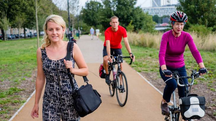 people walking and on bikes using traffic free path