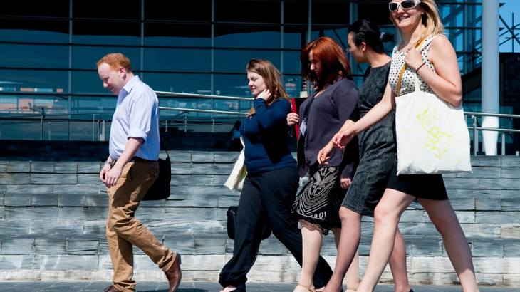 A group of people walking to work