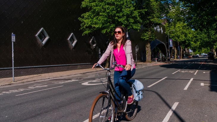 Female cyclist in cycle lane