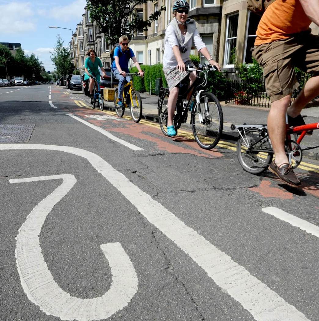 people cycling on 20 mph road