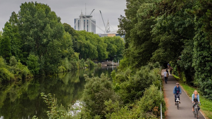 Cyclists on Taff Trail near water