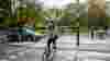 Woman cycling over a road crossing in London