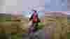 Lady cyclist with Rainbow