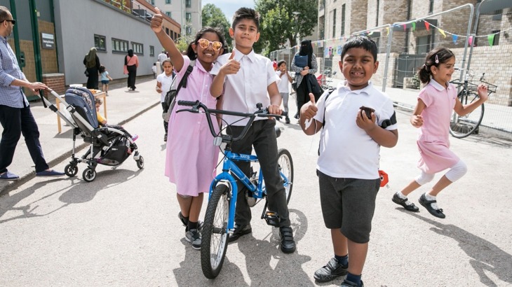 Children in Tower Hamlets pose for a photo 