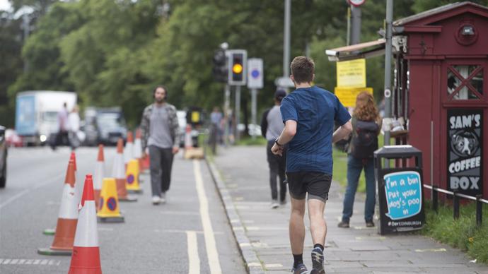 People practicing physical distancing on Bruntsfield Place following Spaces for People interventions