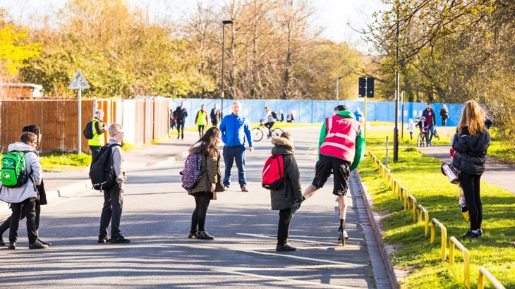 Children enjoying the space created by removing cars from the road
