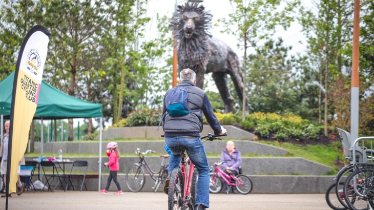 Aslan sculpture and cyclist on CS Lewis Square
