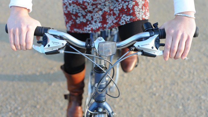 cyclist pushes on the pedals to gain speed