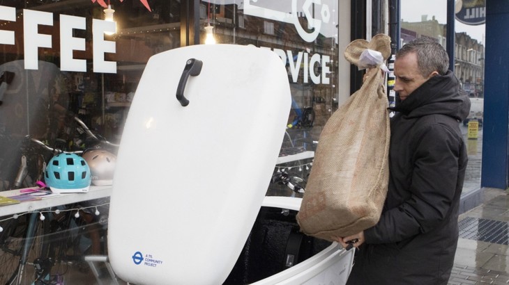 Alper Muduroglu of Peddle My Wheels collecting shopping that shoppers have dropped off at Bon Velo for delivery to their homes