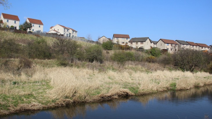 Houses by river