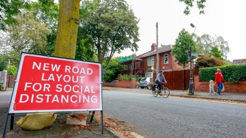 Road sign reading New road layout for social distancing