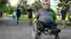Man in wheelchair on shared use path