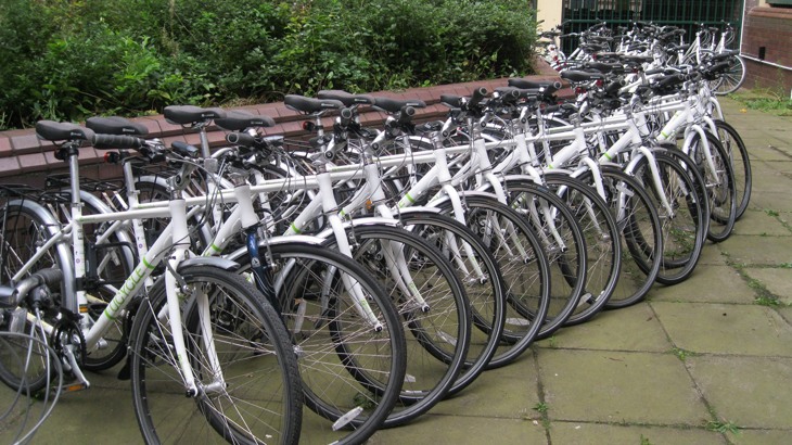 Row of hire bikes outside university building